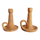 Pair of cork and terracotta candlesticks.
