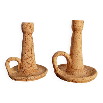 Pair of cork and terracotta candlesticks.