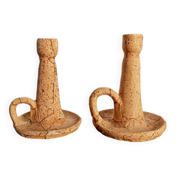 Pair of cork and terracotta candlesticks.