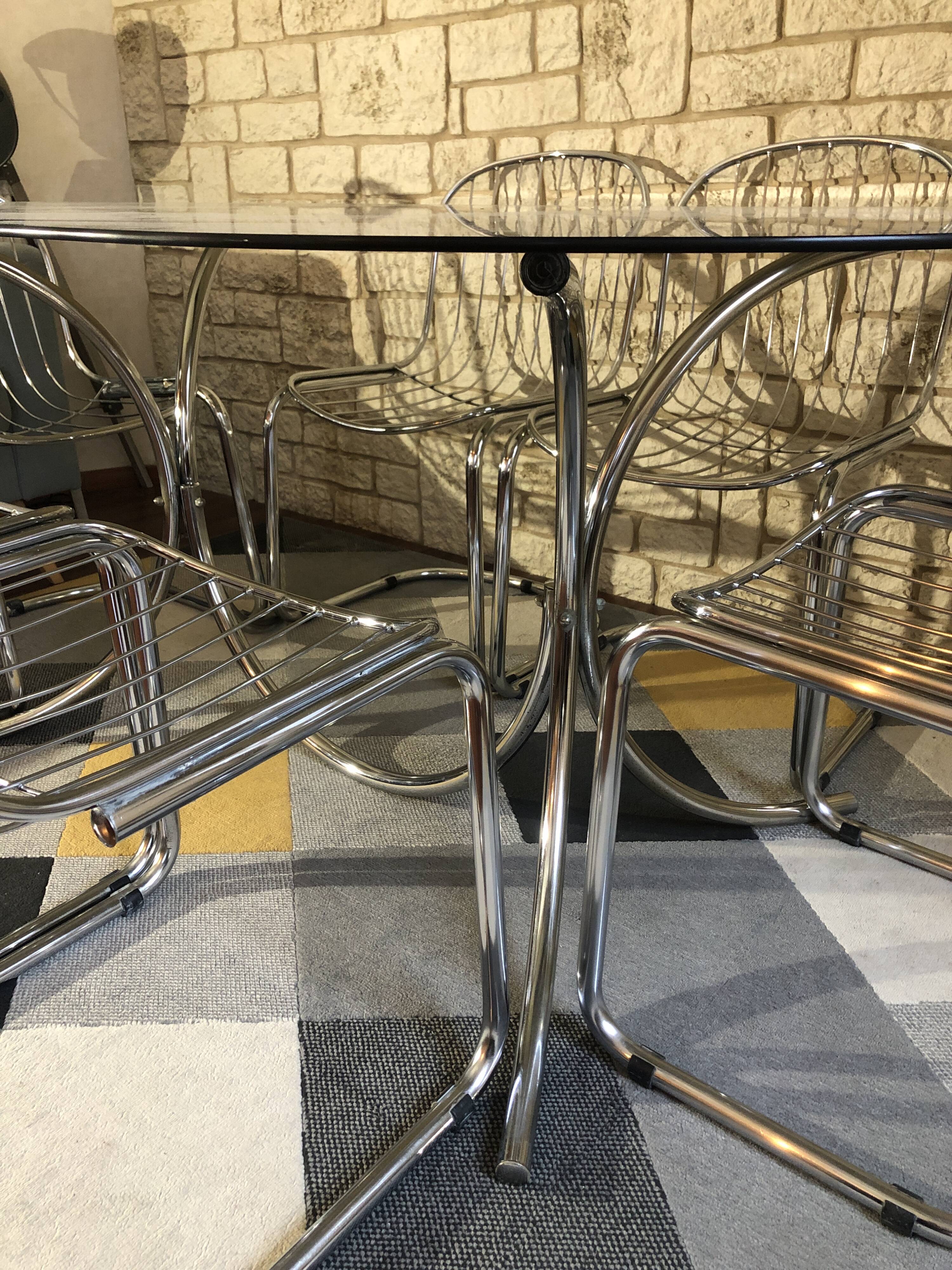 Table and 6 chairs by designer Gastone Rinaldi.