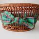 Vintage wicker and rattan basket with tartan fabric.