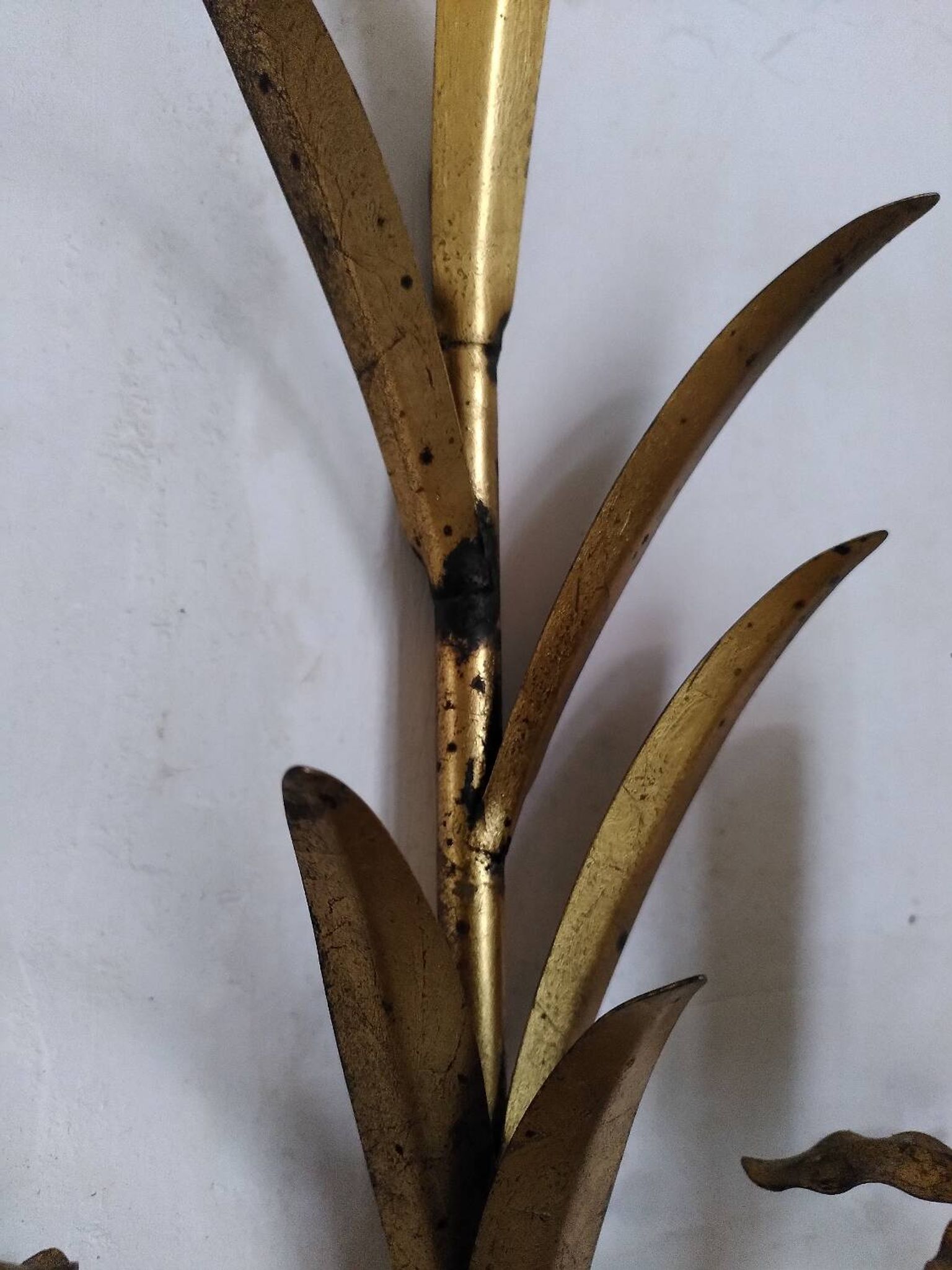 Pair of gold metal leaf wall sconces