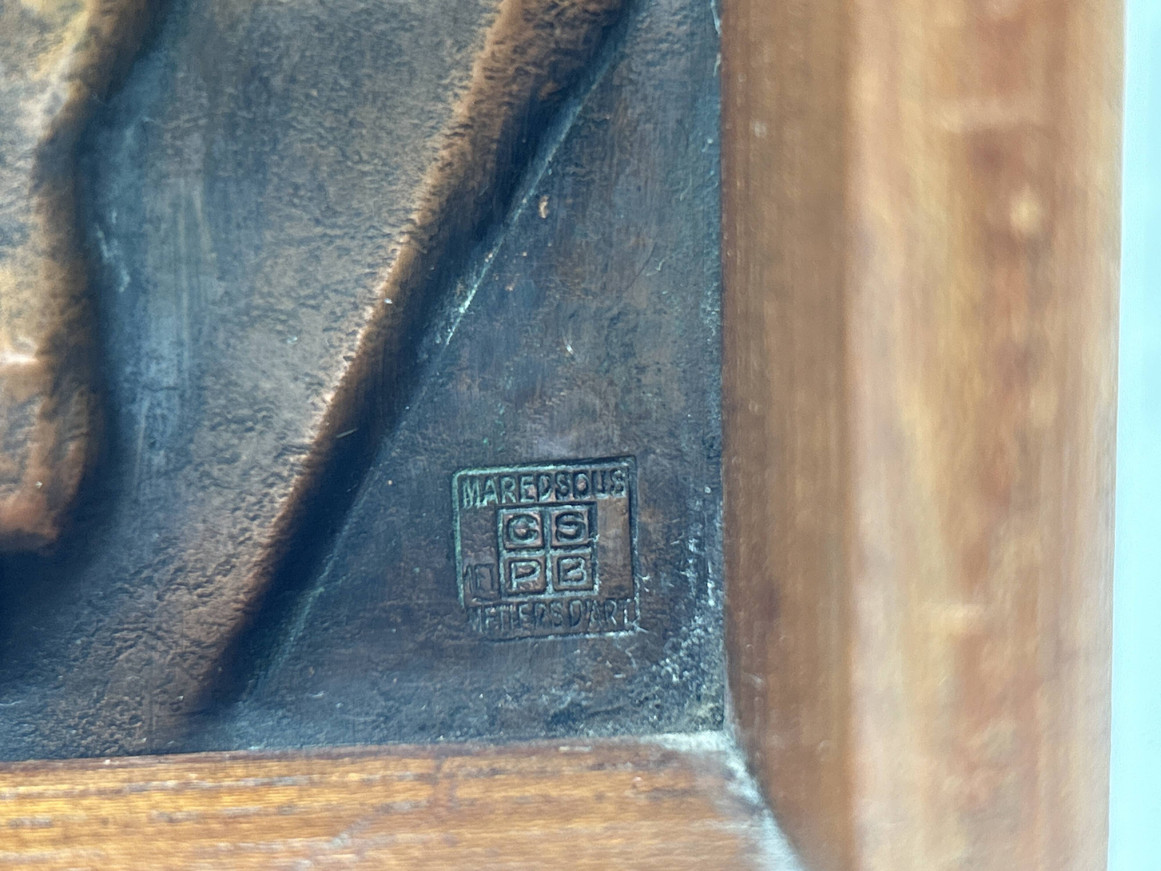 Art deco bas-relief in maredsous brasswork.