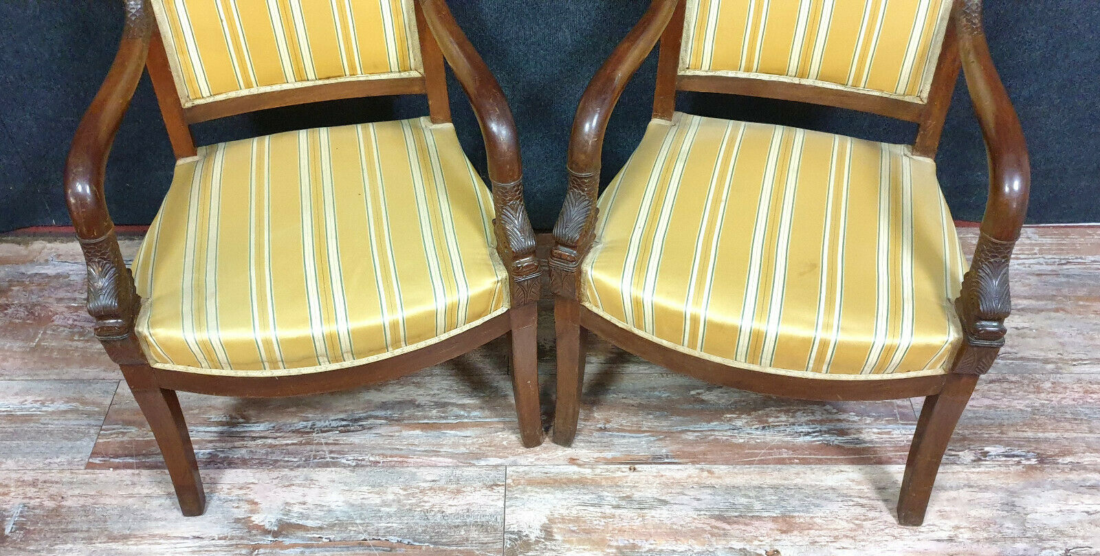 Pair of armchairs to dolphins Empire era in mahogany