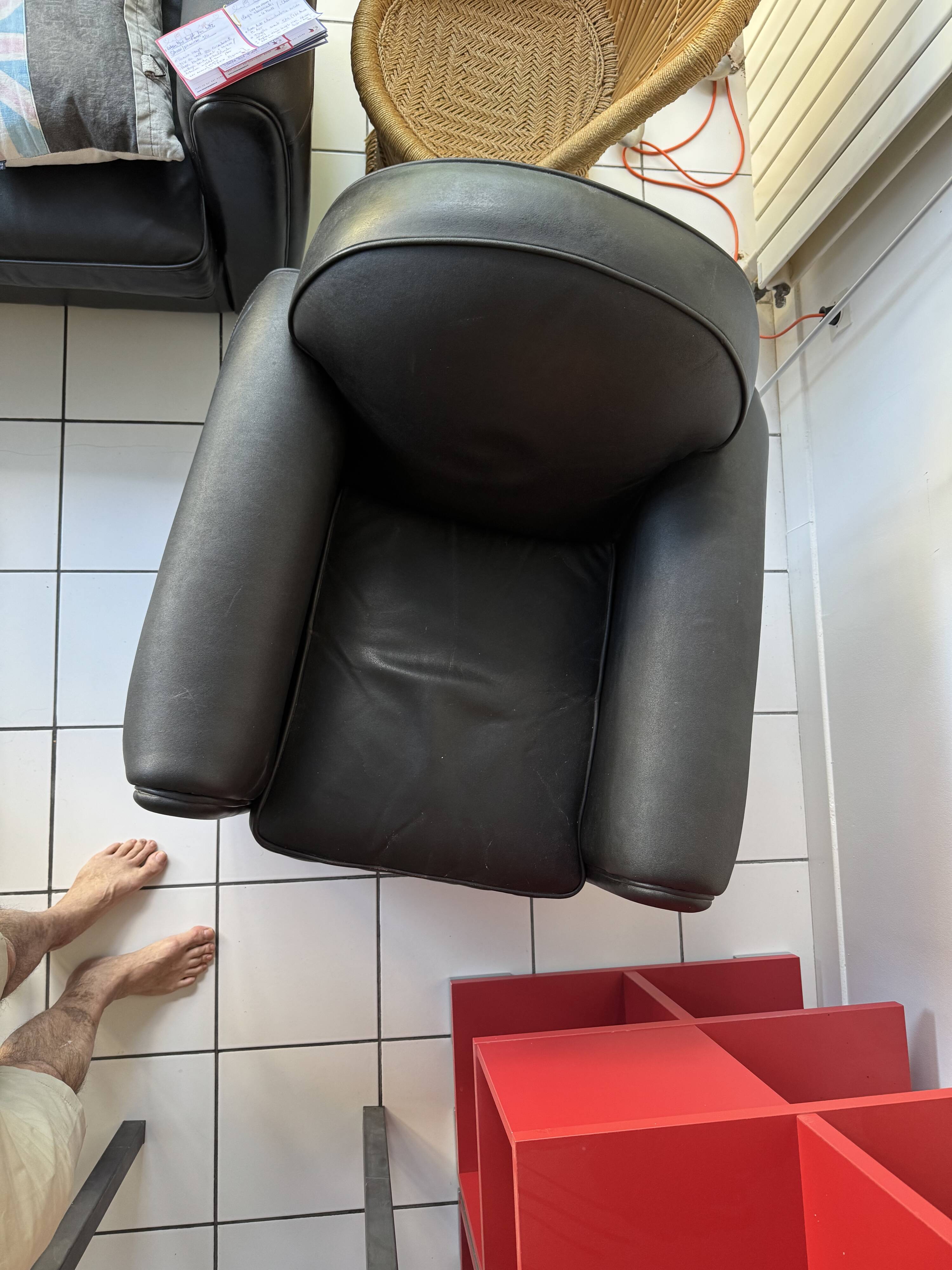 Matching black leather armchair – comfort and elegance