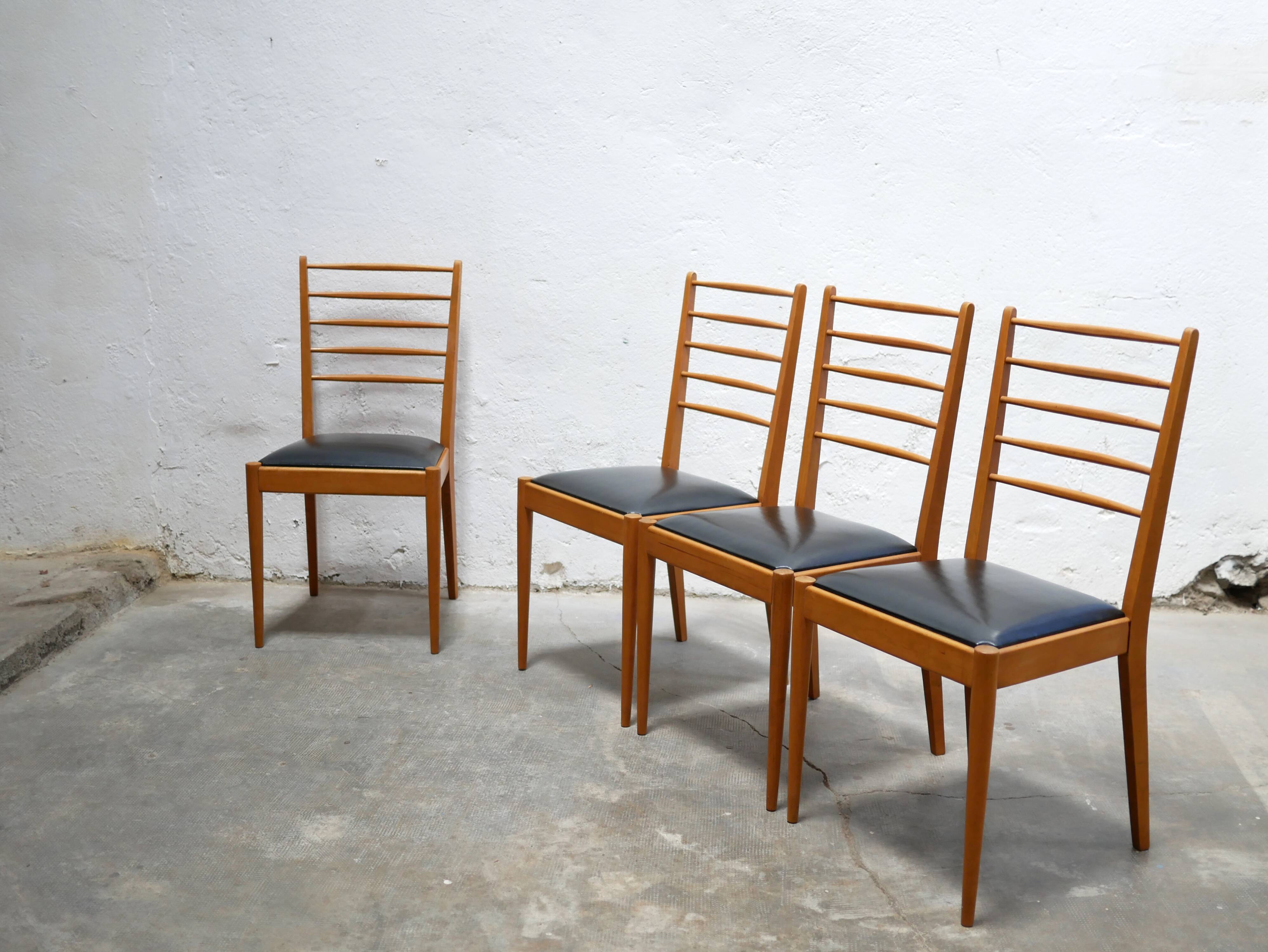Series of 4 vintage chairs in wood and skaï