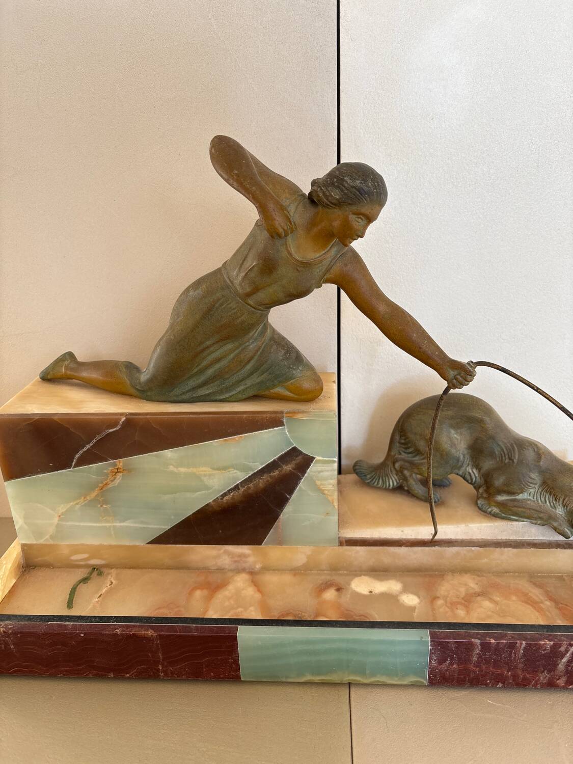 Sculpture of a woman with a greyhound