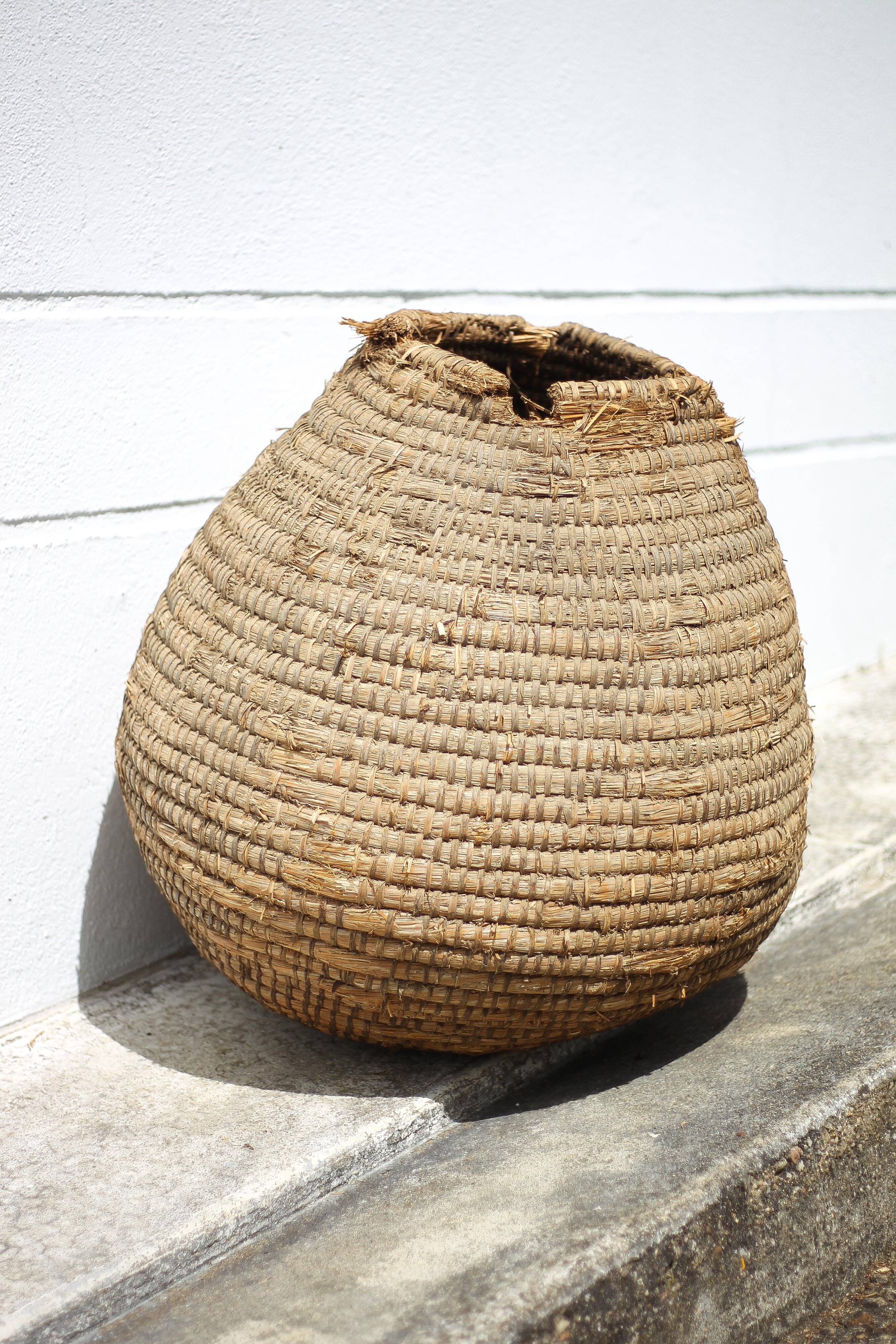 Old basket, burgundy straw and bramble, woven basket, interior decoration, pantry, flowerpot