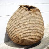 Old basket, burgundy straw and bramble, woven basket, interior decoration, pantry, flowerpot