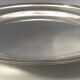 Round silver metal outline water leaf decoration, Félix Frères Goldsmith