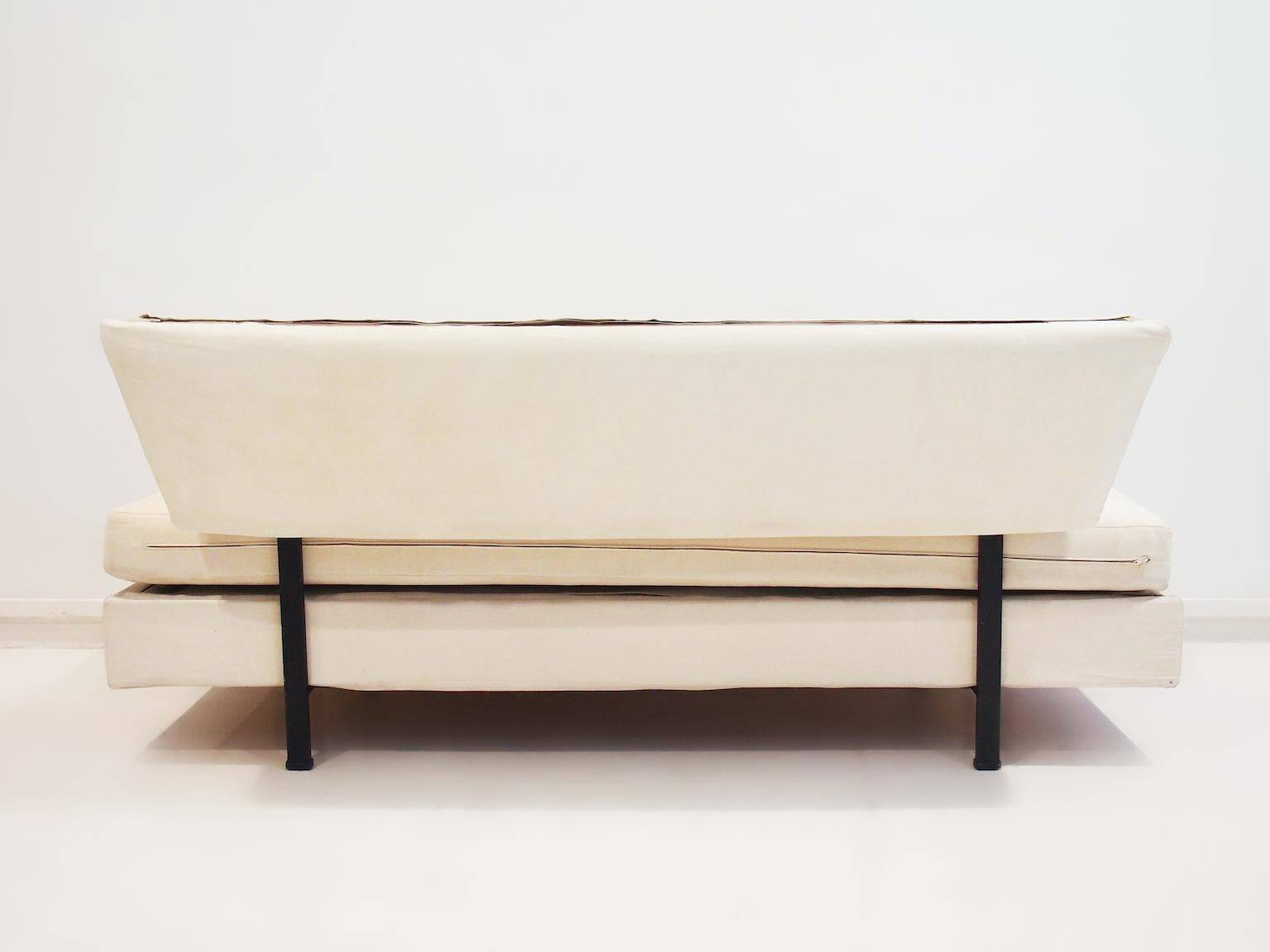 Italian modernist daybed with white upholstery and iron frame.