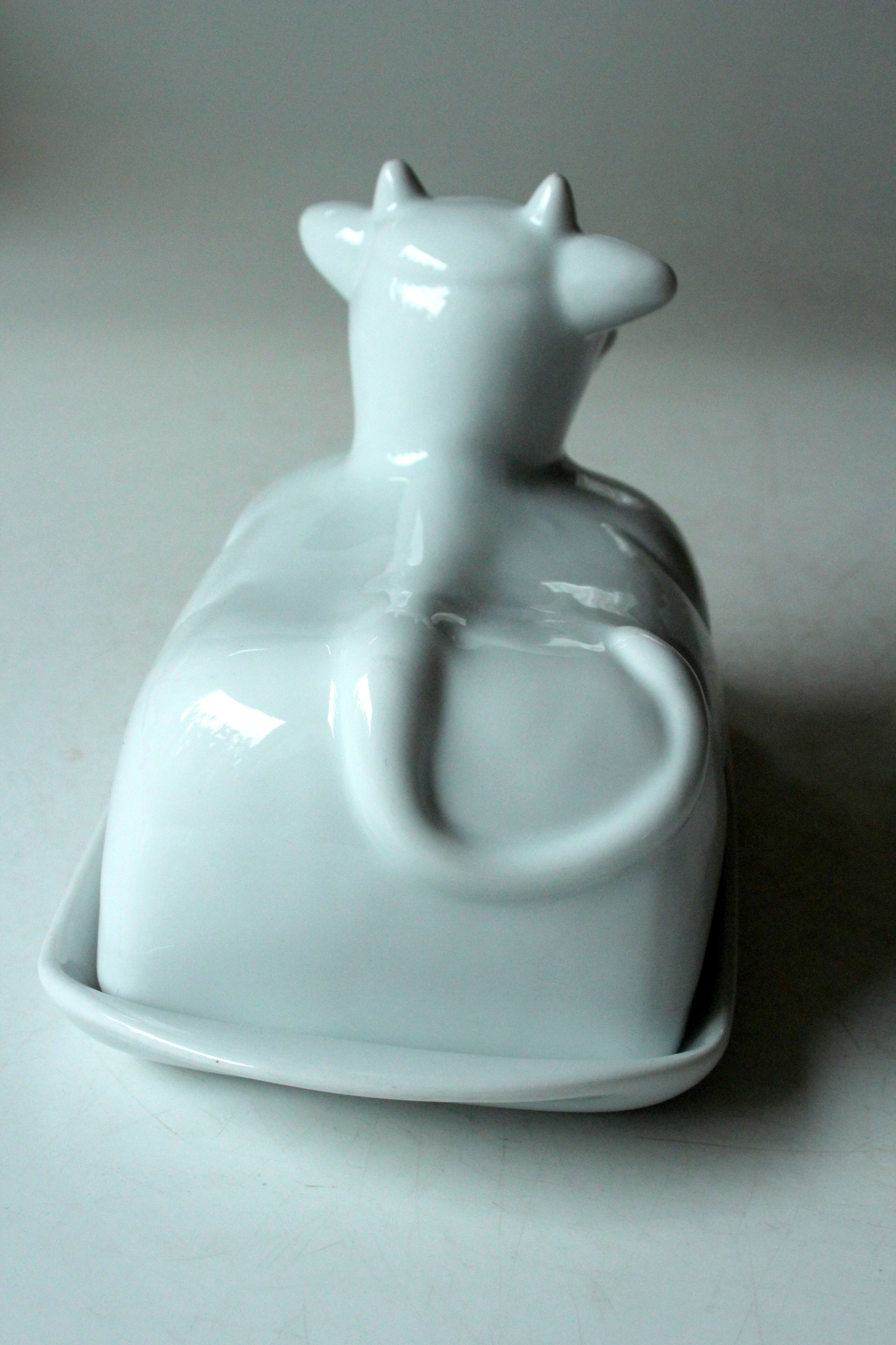 White ceramic butter dish in the shape of a cow, vintage