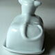 White ceramic butter dish in the shape of a cow, vintage