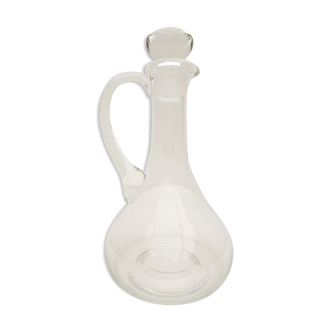 small glass decanter with its handle and spout