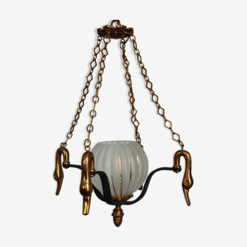 Small old bronze chandelier with its globe