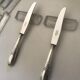 10 Series of 10 silver metal knives François Frionnet
