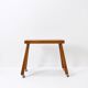 Vintage solid wood side table on casters