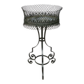 Oval iron planter, on a stand