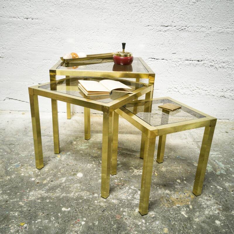Trio of nesting tables in brass and smoked glass