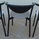 6 gondola-style chairs with a sturdy metal frame and faux leather.