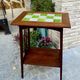 Art Nouveau side table 1910 with double tops in dark oak.
