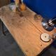 Vintage workbench circa 1930, folding metal leg.