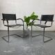 Pair of design armchairs in imitation leather chrome