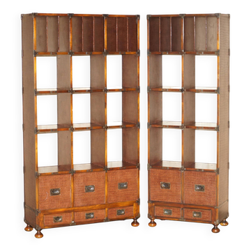 Pair of open bookshelves in crocodile leather with drawers and compartments.