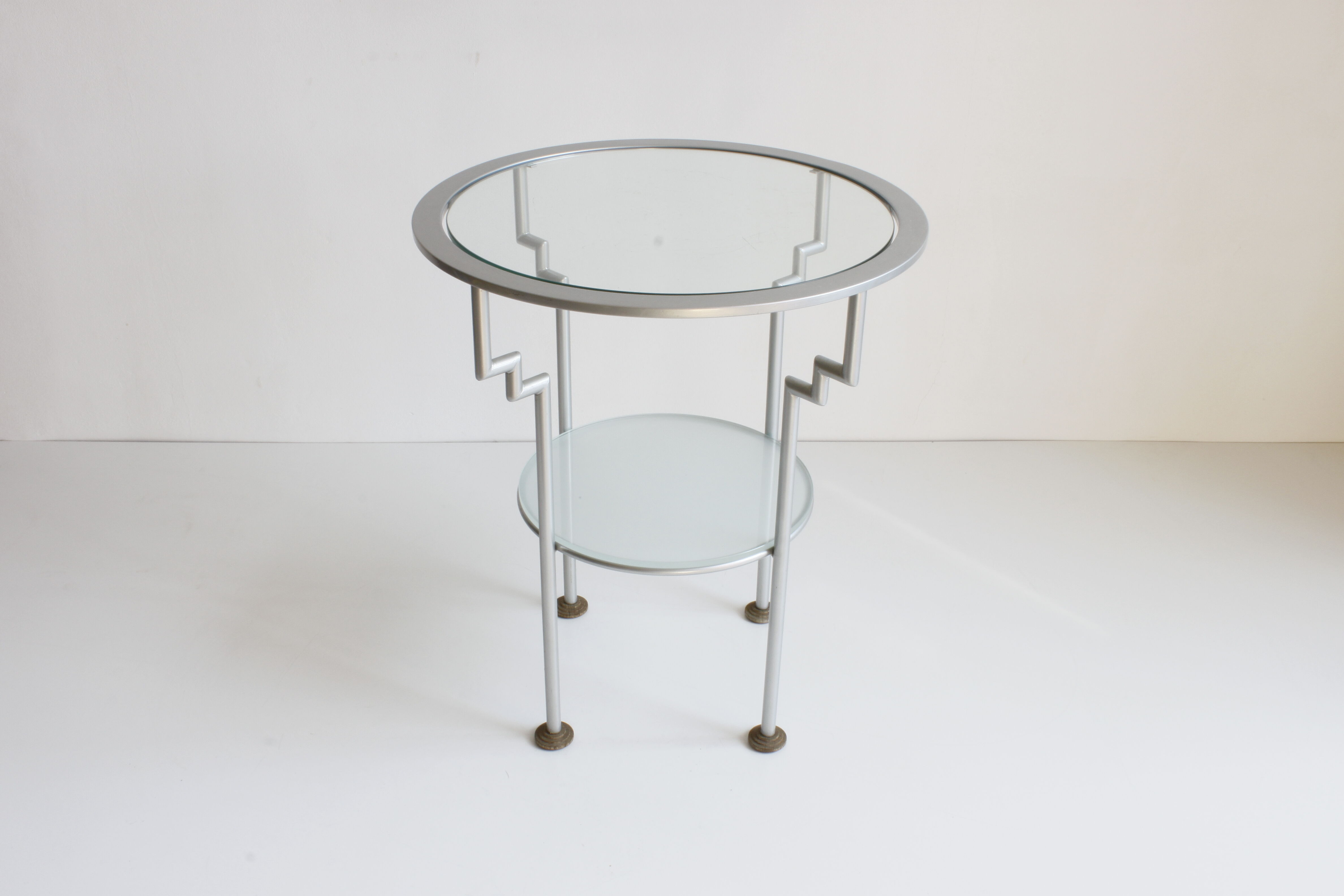 Postmodern round glass  and steel side table, 1980s.