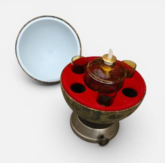 Vintage globe bar service with its liqueur bottle.