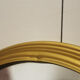 Miroir vintage rond  bordure acier doré