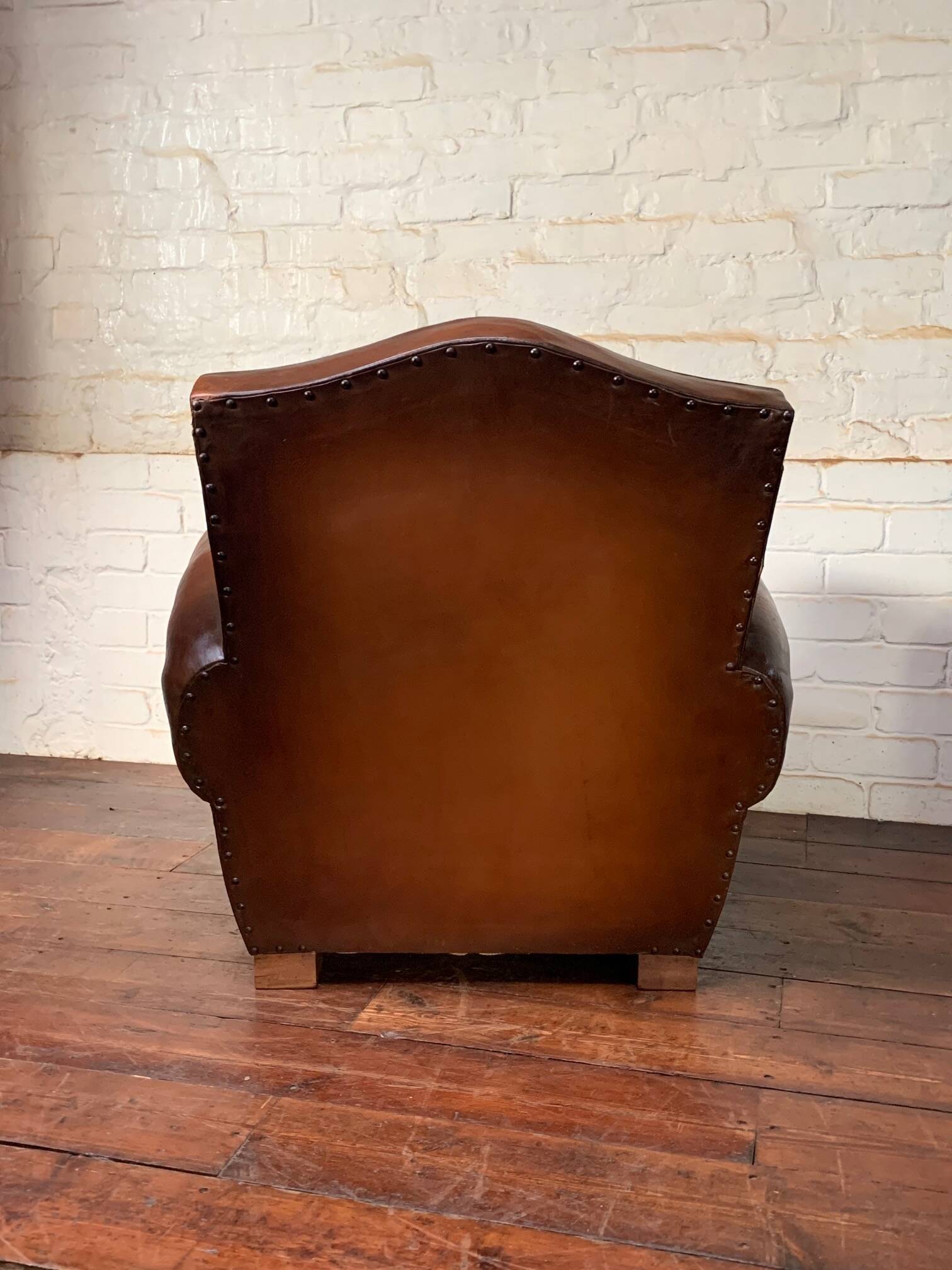 French leather club chair, chapeau de gendarme model circa 1950’s