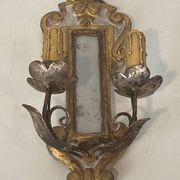 Pair of wall sconces in carved wood and silvered and gilded patinated metal with a central mirror.