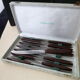 Box of 12 table knives in stainless steel and bakelite EC 144