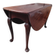 Élégante table ovale antique à abattants