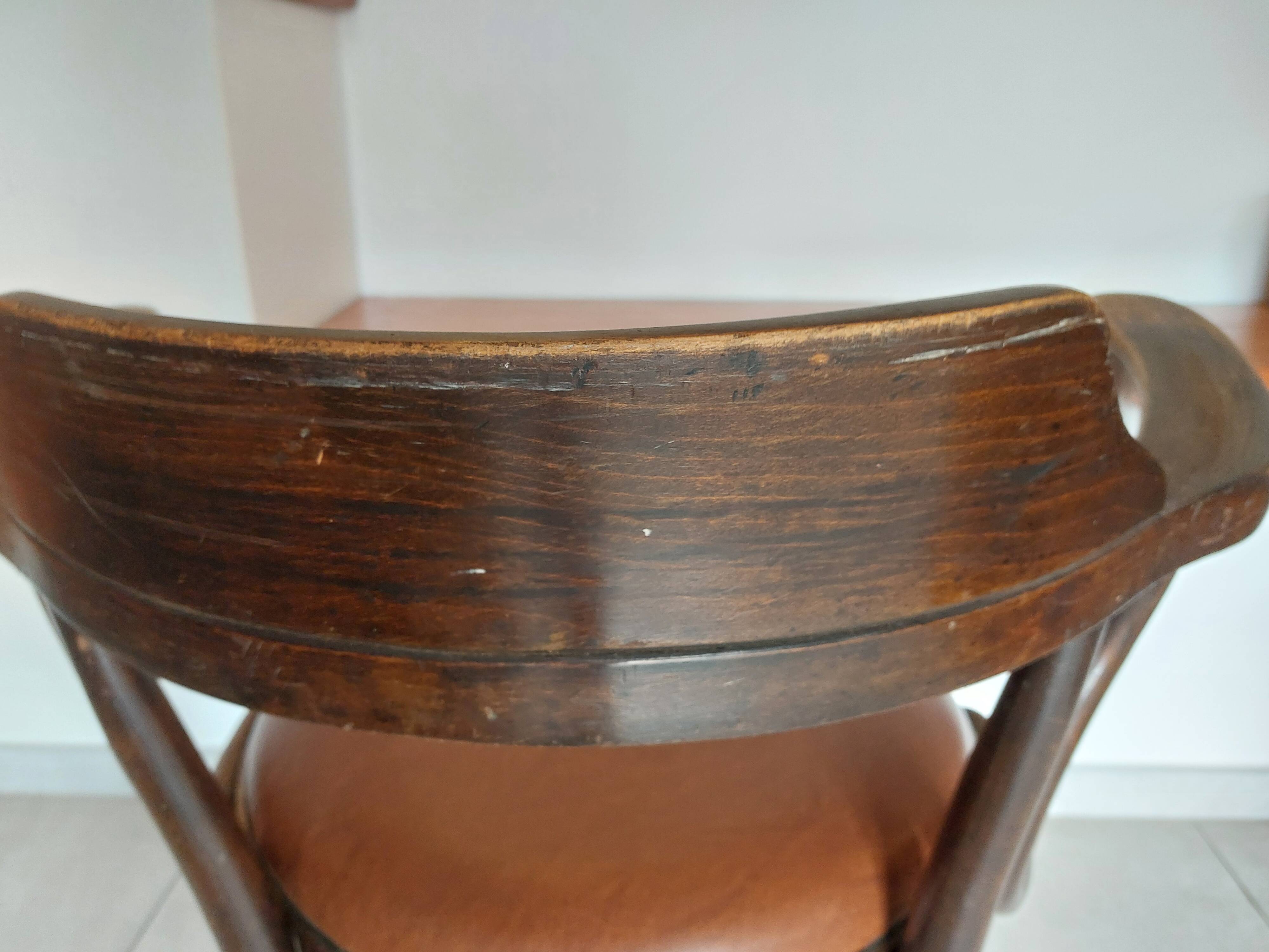 Thonet armchair, swivel, in wood and faux leather.