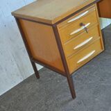 Mid-century Hungarian brown wooden desk with symmetrical drawers and white handles.