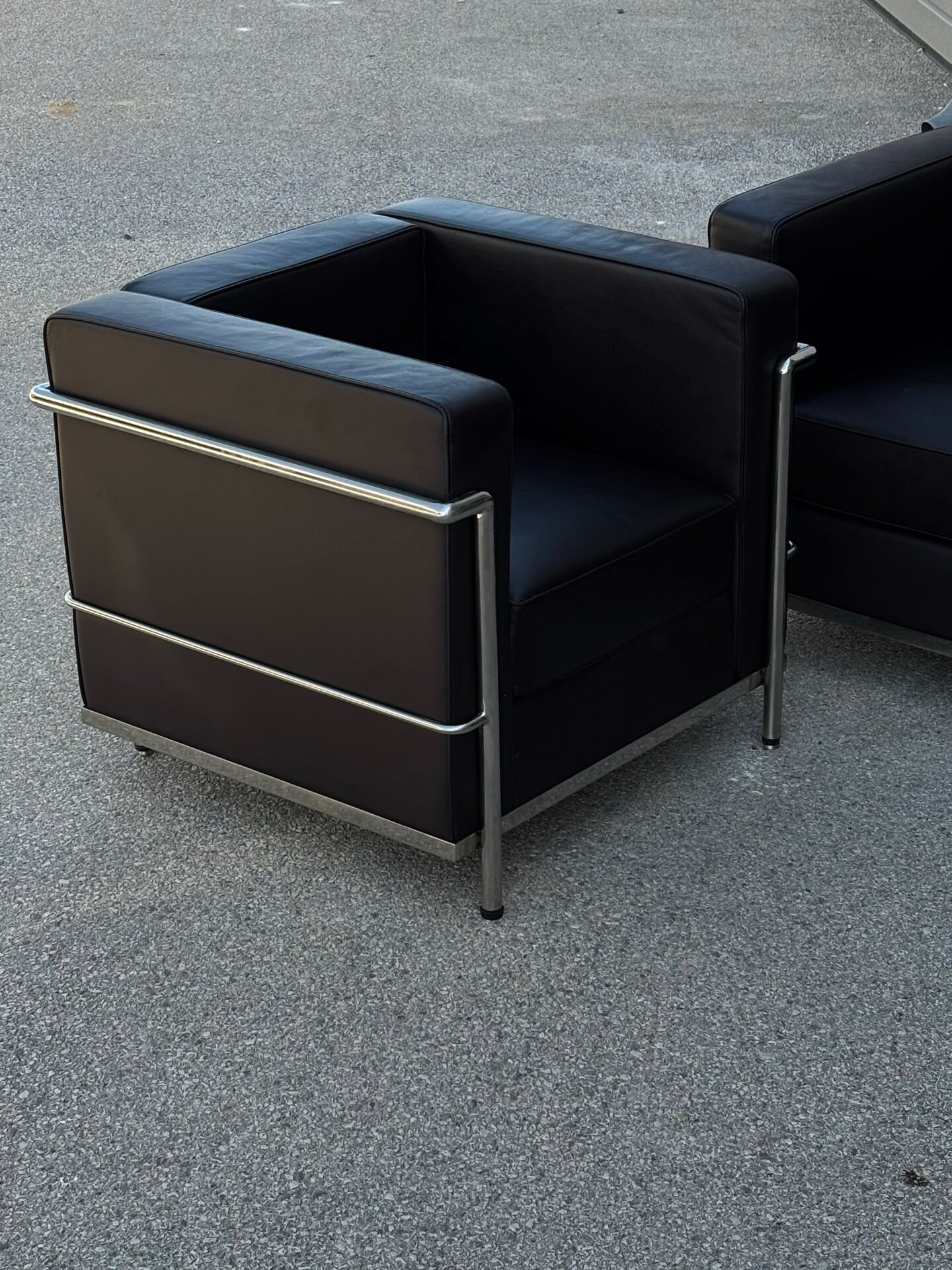 Pair of modernist brown leather armchairs