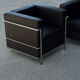 Pair of modernist brown leather armchairs