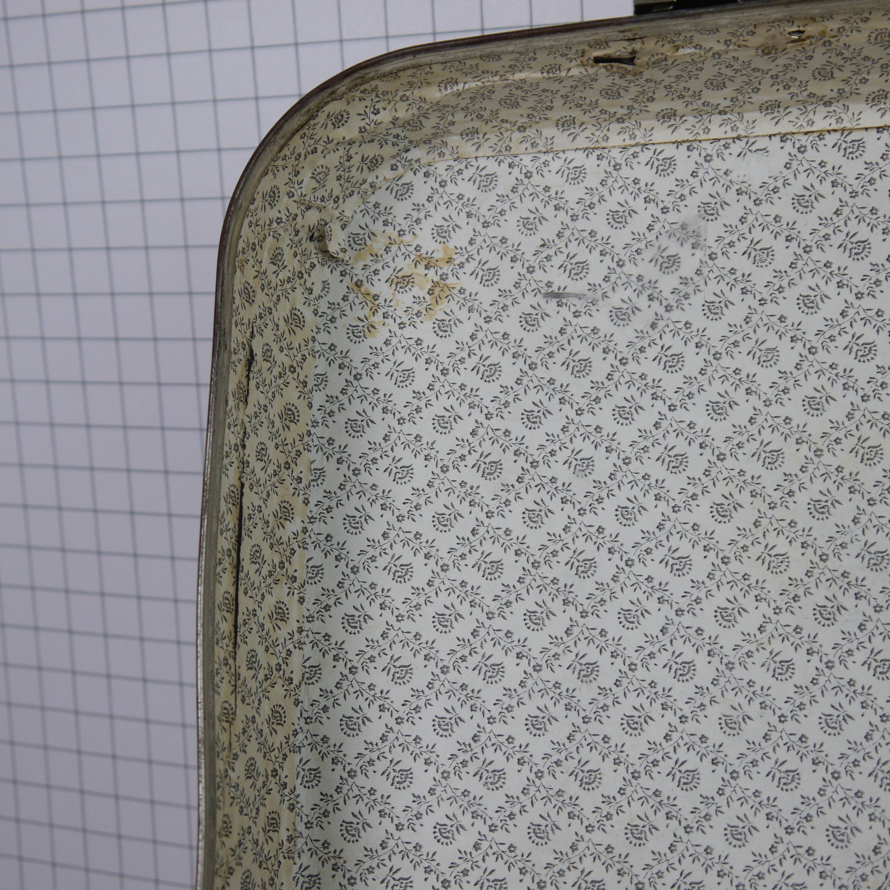 Cardboard and brown leather case