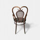Antique curved wooden armchair with caning – Bistro style