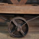 Former wooden factory shelf on metal wheels 1900