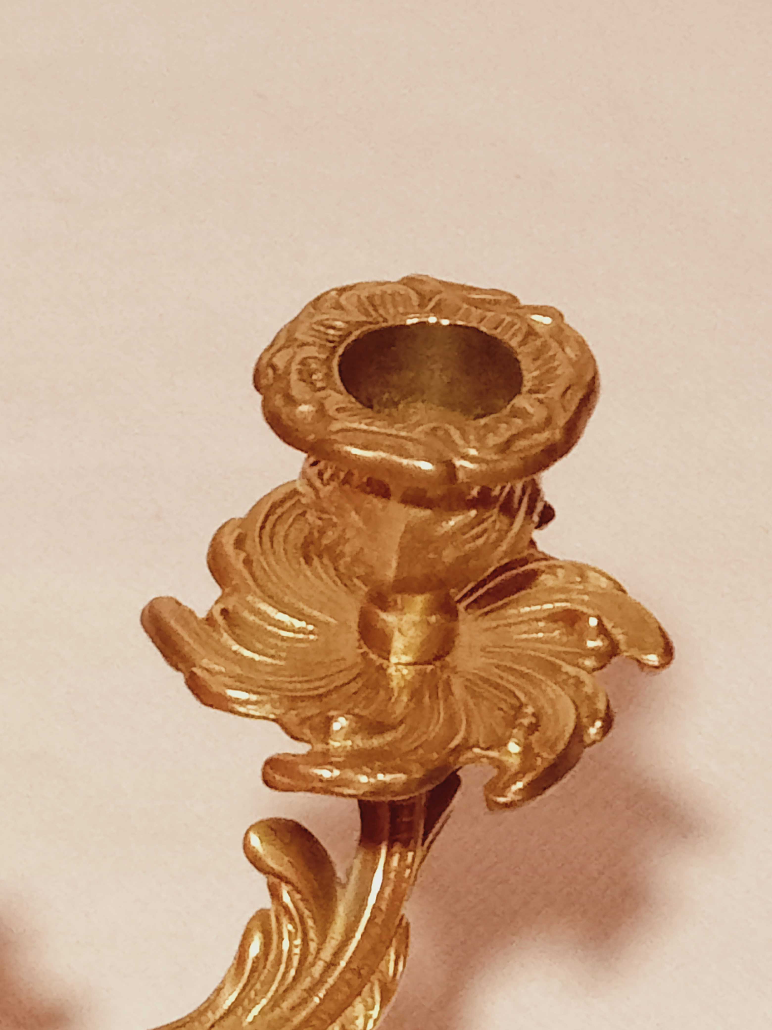 Old candle holder in gilded bronze