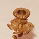 Old candle holder in gilded bronze