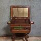 Empire writing table, in mahogany, resting on curved legs.