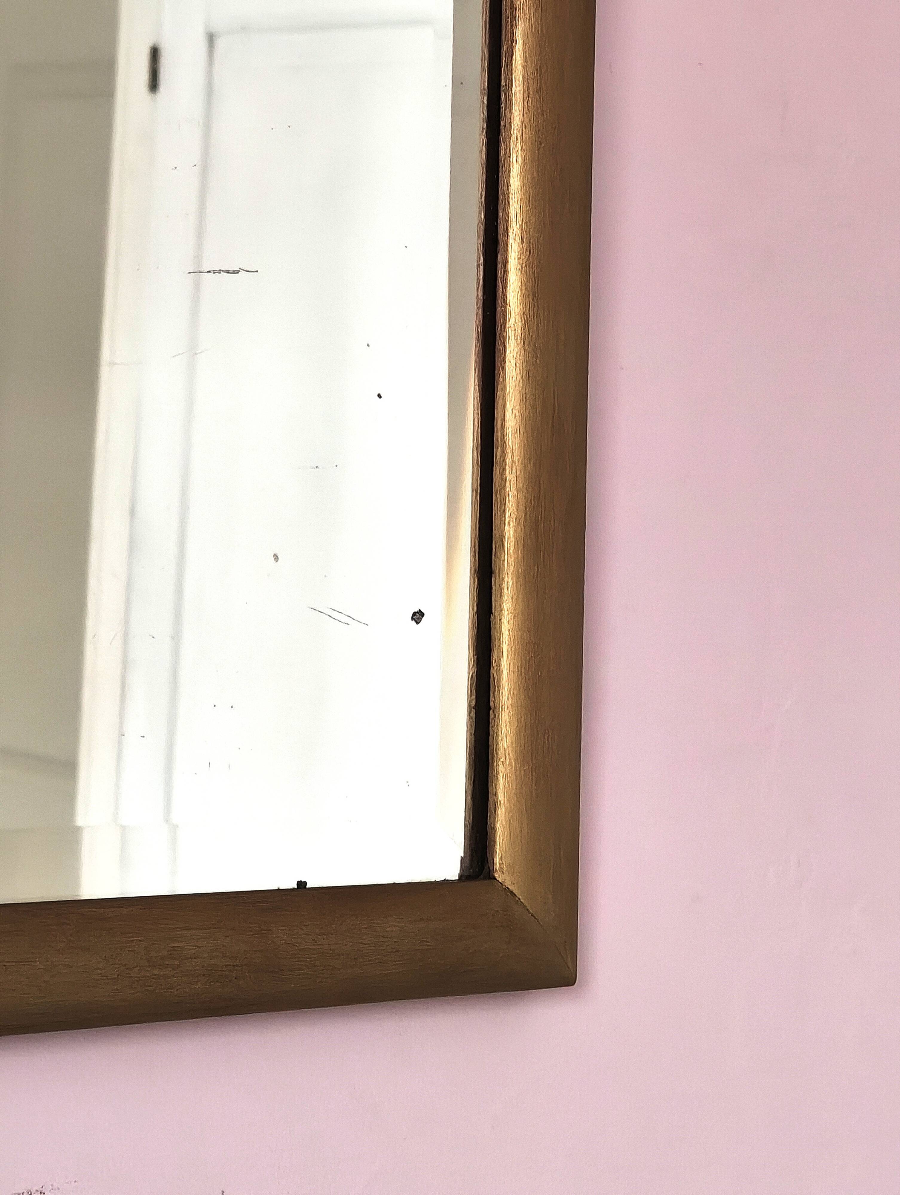 Petit miroir ancien en bois doré et glace biseautée