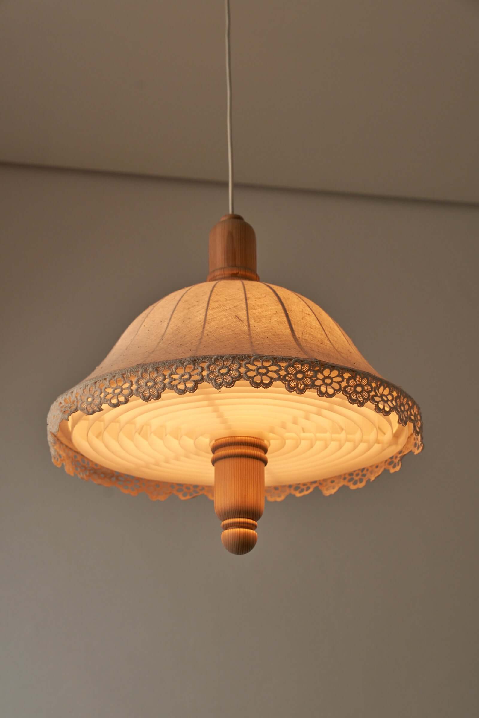 Wood and textile pendant from Sweden