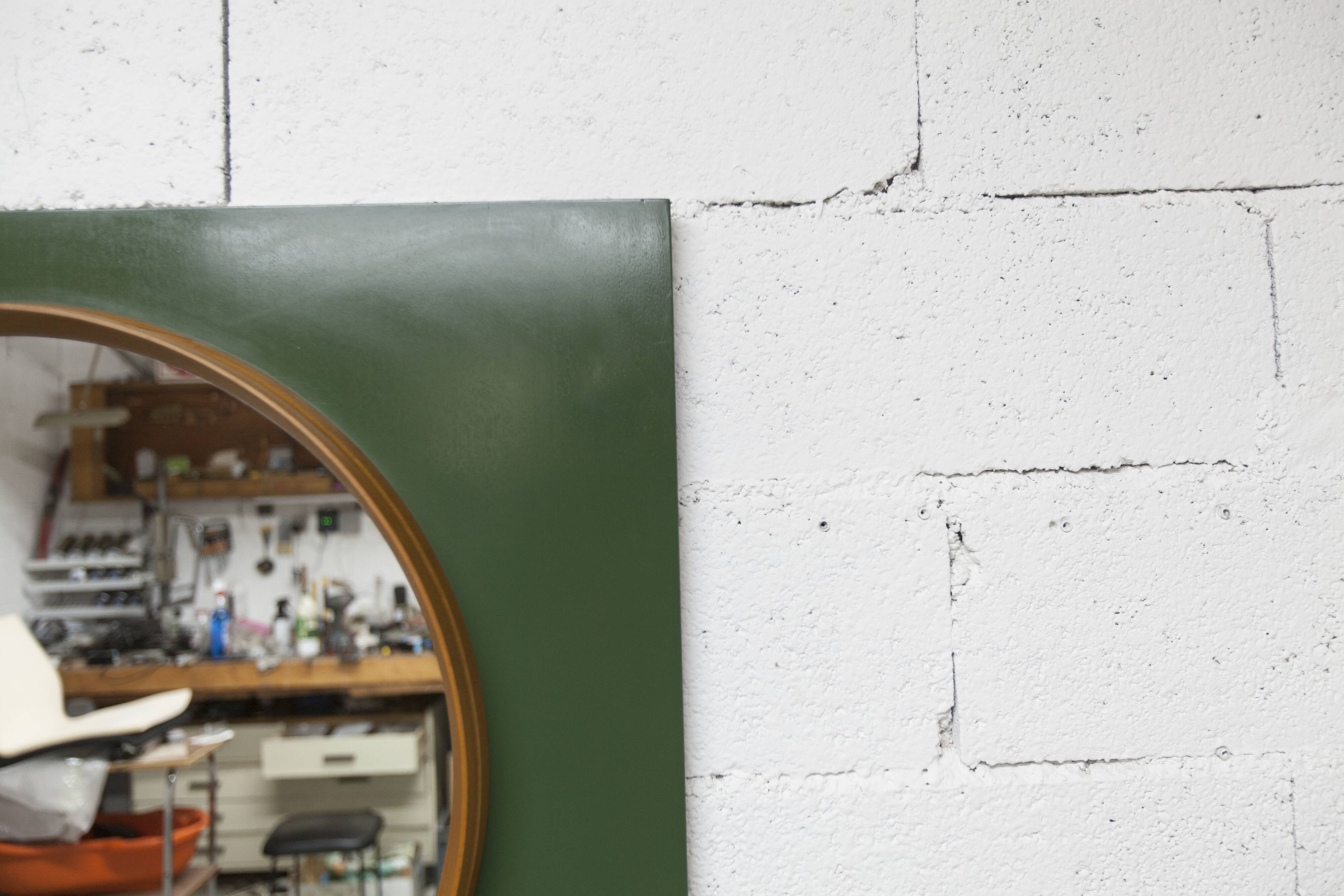 Unusual round wall mirror 60 cm teak edge on green rectangular board 1960.