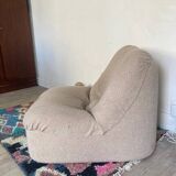 Vintage armchair reupholstered in boucle fabric.