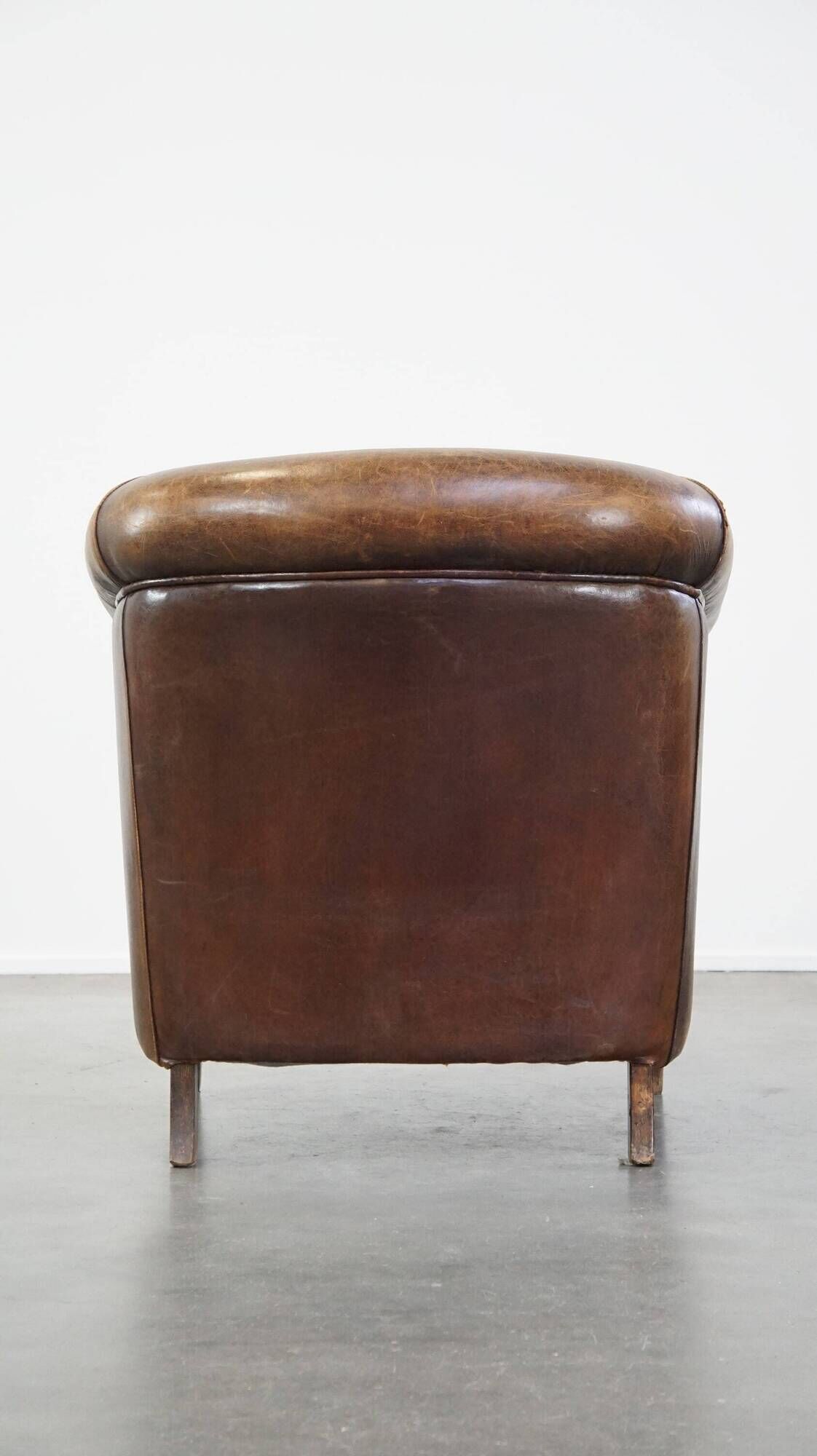 Characterful sheepskin leather club armchair with a luxurious, rustic appearance